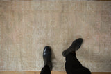 Worn low pile and exposed foundation of a distressed vintage Oushak runner.