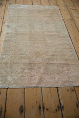 Distressed vintage Oushak rug runner's textured pile and mostly intact original side selvage.