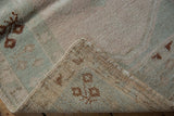 Distressed blush and pale mint pile with hand-knotted reverse of vintage Melas rug.
