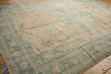 Textural view of distressed vintage Oushak rug, wear to foundation, ivory and pale blue.