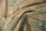 Distressed vintage Oushak pile showing wear to knot heads in blue, green, and ivory.