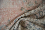 Distressed Turkish Sparta carpet pile in dusty blush, oxidized silver blue, and pale coffee brown.