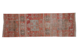 Distressed vintage Oushak runner with multi-medallion design, cinnabar red, and oxidized silver abrashes.