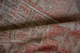 Time-softened blush and beige geometric pile on a distressed vintage Oushak runner.