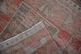 Distressed pile and striped hand-knotted foundation of a vintage Turkish Oushak runner.