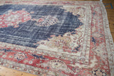 Distressed navy field, brick red border with dragon motifs, and ivory spandrel.
