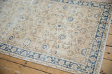 Distressed vintage Sparta runner, ivory field with cobalt blue palmettes and foundation showing through.
