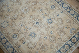 Distressed Sparta runner, close-up of worn ivory field, blue floral palmettes and visible foundation.