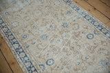 Distressed vintage Sparta runner with aged ivory field, blue palmettes, and floral vinery.