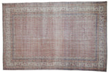 Distressed vintage Turkish Sparta carpet, pale rust allover boteh design with ivory and indigo borders.