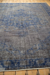 Low angle view of the time-softened texture on a distressed overdyed Oushak carpet.