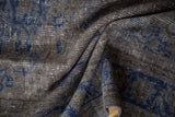 Distressed texture of an overdyed Oushak showing wear to the knot heads.