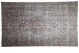 Distressed Oushak rug, silver and charcoal, floral roundel medallion, visible pile wear. 5'8