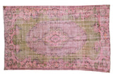 Distressed overdyed Oushak rug, pink and olive green floral oblong medallion, 5' x 8'3