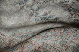 Worn pile texture of distressed Oushak carpet showing visible foundation and floral motifs.