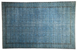 Distressed vintage Oushak carpet in denim blue with faded allover floral design, 6'8