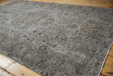 Distressed vintage Oushak carpet, showcasing worn silver and chocolate vinery and visible knot heads.