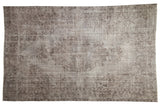 Distressed vintage Turkish Oushak carpet, faded floral medallion in silver and chocolate brown.