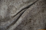 Distressed overdyed Oushak carpet texture with oxidized silver and chocolate brown, foundation showing through.