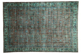 Distressed Oushak carpet with overdyed dusty terracotta, sea foam, and cobalt blue vinery.