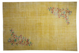 Faded golden yellow distressed Oushak rug with red, green, brown floral vinery.