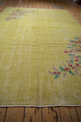 Texture of distressed yellow pile on a vintage Oushak rug with intact white side selvage.