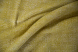Distressed vintage Oushak carpet pile in chartreuse, revealing white foundation.