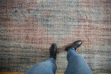 Textured distressed overdyed Oushak carpet pile showing dusty blue, mauve, and red.