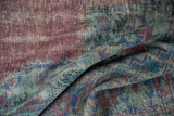 Distressed Oushak carpet texture with mostly even wear, featuring faded raspberry and sea foam green.