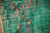 Distressed Turkish Art Deco carpet showing pale turquoise green, worn lotus flowers, and foundation.