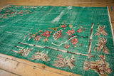Distressed pale turquoise green Turkish Art Deco rug with dusty rose lotus flower corner.