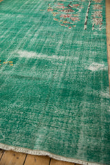 Pale turquoise green blue Art Deco carpet, distressed pile revealing foundation and fringe.