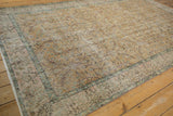 Distressed Turkish Sparta carpet detail, dusty gold field, sea foam green vinery, pale mauve.