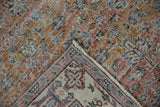 Distressed vintage Sparta rug pile, terracotta hues, worn knot heads, and reverse border.