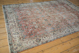 Distressed apricot field with scrolling vinery and ivory floral border, sea foam green accents.