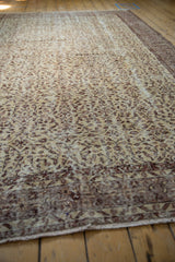 Distressed pile of vintage Sparta carpet, ivory and bronze scrolling vinery, mostly even wear to knot heads.
