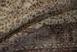 Distressed vintage Sparta carpet detail with worn pile and ivory scrolling vinery.
