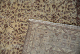 Distressed vintage Sparta carpet's ivory and bronze vinery pile with geometric patterned reverse.