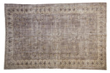 Distressed Sparta Carpet with faded silver, ivory, charcoal floral medallion and field, 6'6