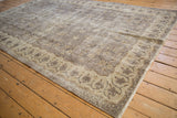 Vintage Distressed Sparta carpet, showing worn pile, faded floral motifs, and muted colors.