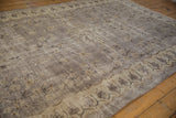 Textured field with faded floral bouquets on this distressed vintage Sparta rug.