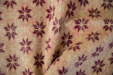 Distressed vintage Sparta runner pile, showing black cherry red floral starbursts against pale ivory, yellow, and dusty rose.