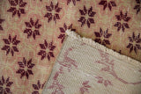 Distressed pile texture, fringe, and hand-knotted reverse of the Vintage Sparta runner.