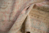 Distressed Oushak carpet pile with mostly even wear, pale rose, ivory, seafoam green.