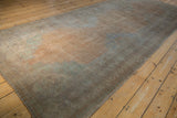 Angled perspective along the vintage Oushak runner, highlighting its even wear and muted sandalwood tones.
