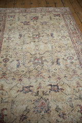 Distressed Sparta runner surface with worn ivory, brick red, and navy floral motifs.