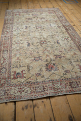 Textured pile of a distressed Sparta runner, showing expressive floral palmettes and time-softened tones.