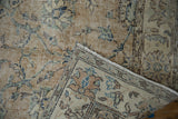 Folded vintage Sparta runner, showing distressed sand floral pattern with even wear and foundation.