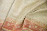 Distressed texture of a vintage Turkish Oushak rug, ivory pile and terracotta germinating plant border.