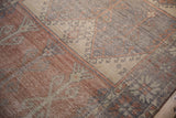 Distressed vintage Oushak rug pile with wear to knot heads and foundation showing.